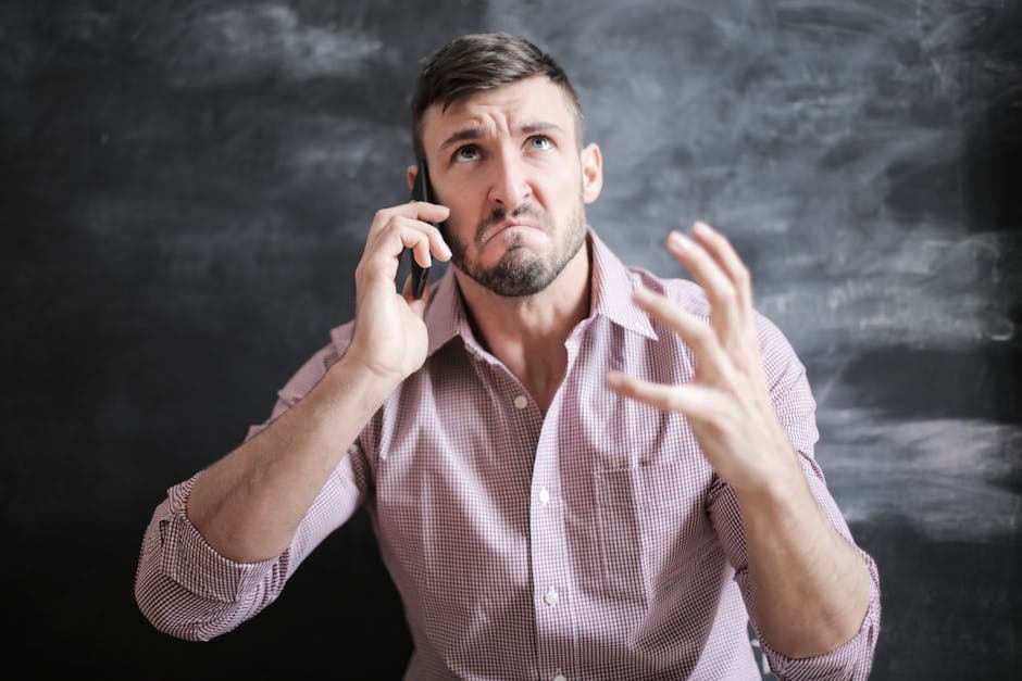 Hands holding a phone, worried expression