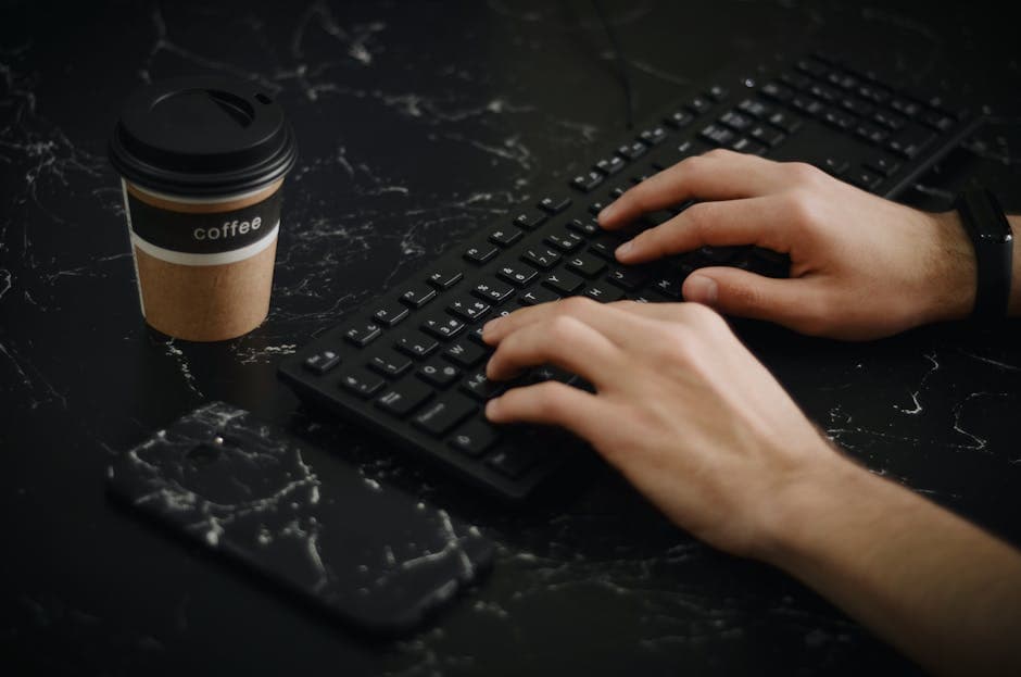 Hands typing on a smartphone